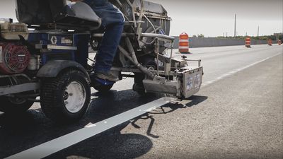 Thermoplastic striping being applied to a highway