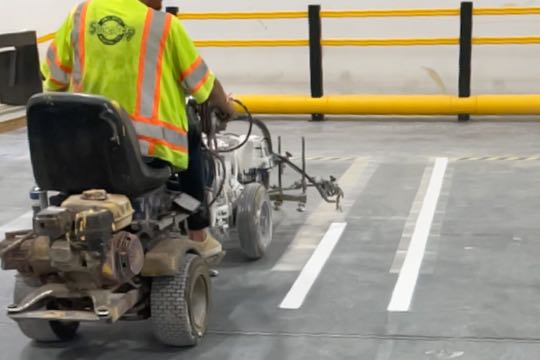 Stripe-It-Up crew re-striping a parking lot