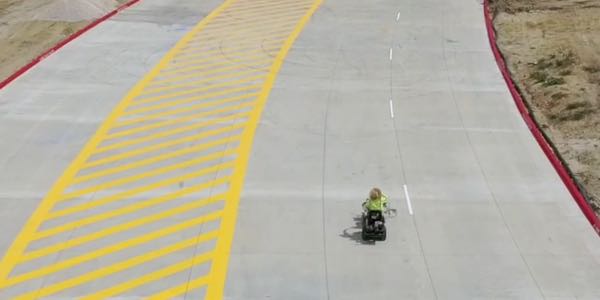 Striping crew applying markings to a new shipping facility roadway