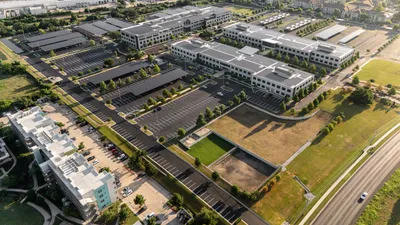 Aerial photo of commercial parking lot repair and maintenance work
